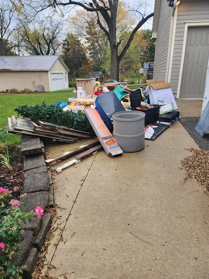 Dumpster being loaded with debris for 3 Yard Dumpster Rental in Glenn Heights